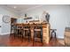 Custom bar area with rustic wood counter and bar stools, creating a unique space for entertaining and relaxation at 1295 Heritage Dr, Villa Rica, GA 30180