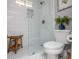 Modern bathroom with a glass-enclosed shower, subway tile walls, and elegant fixtures, providing a spa-like experience at 1295 Heritage Dr, Villa Rica, GA 30180