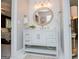 Chic bathroom featuring shiplap walls, decorative mirror, and a contemporary vanity, creating a harmonious blend of design at 1295 Heritage Dr, Villa Rica, GA 30180