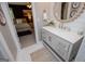 Stylish bathroom boasts shiplap walls, a decorative mirror, and a modern vanity, seamlessly blending style and comfort at 1295 Heritage Dr, Villa Rica, GA 30180