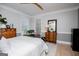 Bright bedroom featuring wood floors, dresser, and comfortable furniture at 1295 Heritage Dr, Villa Rica, GA 30180