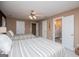 Comfortable bedroom featuring two beds, ceiling fan, and ensuite bathroom, perfect for a peaceful retreat at 1295 Heritage Dr, Villa Rica, GA 30180