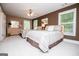 Inviting bedroom with two beds, a dresser, and large windows, creating a bright and comfortable atmosphere at 1295 Heritage Dr, Villa Rica, GA 30180