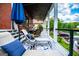 Relaxing deck with lounge seating and lake views, perfect for outdoor entertaining and enjoying serene waterfront scenery at 1295 Heritage Dr, Villa Rica, GA 30180