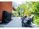 Relaxing deck area with grill and lounge seating for outdoor enjoyment at 1295 Heritage Dr, Villa Rica, GA 30180
