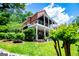 Beautiful home with expansive decks offering outdoor enjoyment and stunning views of the lush backyard and waterfront at 1295 Heritage Dr, Villa Rica, GA 30180