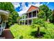 Lush backyard with a view of a house with a deck, perfect for relaxing outdoors in a serene environment at 1295 Heritage Dr, Villa Rica, GA 30180