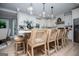 Bright kitchen features a spacious quartz island with pendant lighting and ample seating at 1295 Heritage Dr, Villa Rica, GA 30180