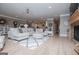 Open-concept living room featuring a large sectional, hardwood floors, and modern lighting at 1295 Heritage Dr, Villa Rica, GA 30180