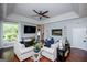 Inviting living space with couches, decor, and large windows offering natural light at 1295 Heritage Dr, Villa Rica, GA 30180