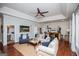 Spacious living area featuring stylish sofas, decor, and lake-themed artwork at 1295 Heritage Dr, Villa Rica, GA 30180