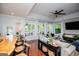 Open-concept living room features a lake view, hardwood floors, and bar seating at 1295 Heritage Dr, Villa Rica, GA 30180