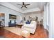 Comfortable living room showcases a large area rug, ceiling fan, and lake-themed decor at 1295 Heritage Dr, Villa Rica, GA 30180