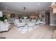 Open-concept living room featuring a large sectional, hardwood floors, and modern lighting at 1295 Heritage Dr, Villa Rica, GA 30180