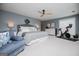 Spacious primary bedroom featuring a comfortable sitting area, exercise bike, and ample natural light at 1295 Heritage Dr, Villa Rica, GA 30180