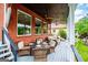 Inviting porch with outdoor seating overlooking lush greenery and lake view at 1295 Heritage Dr, Villa Rica, GA 30180