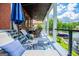 Charming porch with lake view, comfortable seating, and stylish decor at 1295 Heritage Dr, Villa Rica, GA 30180