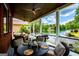 Covered porch showcasing lake views and comfortable outdoor dining at 1295 Heritage Dr, Villa Rica, GA 30180