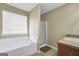 Well-maintained bathroom featuring a soaking tub, walk-in shower, and vanity at 502 Gallantry Trl, Mcdonough, GA 30252