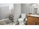 Functional bathroom with a shower, toilet, vanity, and neutral-colored walls at 502 Gallantry Trl, Mcdonough, GA 30252
