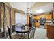 Eat-in kitchen features stainless steel appliances, and a granite topped table near a window at 502 Gallantry Trl, Mcdonough, GA 30252