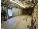 Large unfinished basement with exposed insulation, a window, and a door at 110 Kari Glen Way, Fayetteville, GA 30215