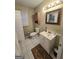 Cozy bathroom featuring white vanity, decorative mirror, and tile flooring at 110 Kari Glen Way, Fayetteville, GA 30215