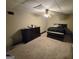 Bedroom with carpet, ceiling fan, and a chest of drawers next to a bed at 110 Kari Glen Way, Fayetteville, GA 30215