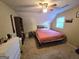 Cozy bedroom with sloped ceilings, natural light, and comfortable furnishings at 110 Kari Glen Way, Fayetteville, GA 30215