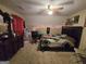 Cozy bedroom with carpet, a ceiling fan, and furnishings that complement the sloped ceiling at 110 Kari Glen Way, Fayetteville, GA 30215