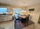 Inviting dining area with a wooden table, chairs, and natural light from the backyard door at 110 Kari Glen Way, Fayetteville, GA 30215