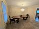 Traditional dining room with chandelier, classic table, and plush carpeting at 110 Kari Glen Way, Fayetteville, GA 30215