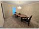 Traditional dining room with chandelier, classic table, and plush carpeting at 110 Kari Glen Way, Fayetteville, GA 30215