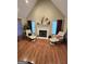 Comfortable living room showcasing a fireplace, vaulted ceilings, and hardwood floors at 110 Kari Glen Way, Fayetteville, GA 30215