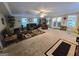 Spacious living room offers ample seating and natural light from the sliding glass doors at 110 Kari Glen Way, Fayetteville, GA 30215