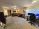 Open-concept living room with a large sofa, desk setup, and ample space at 110 Kari Glen Way, Fayetteville, GA 30215