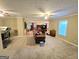 Spacious living room with plush carpeting, neutral tones, and natural light at 110 Kari Glen Way, Fayetteville, GA 30215