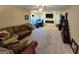 Cozy living room featuring a corner sofa, fireplace, and built-in TV at 110 Kari Glen Way, Fayetteville, GA 30215