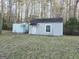 Exterior shot of a shed with a door, window, and a second metal storage shed to the side at 110 Kari Glen Way, Fayetteville, GA 30215