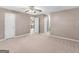 Carpeted bedroom with ceiling fan, multiple doors and connections to other parts of the house at 105 Birch Creek Cir, Mcdonough, GA 30253