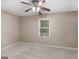 Bedroom with neutral walls and carpet, natural light from the window, and ample electrical outlets at 105 Birch Creek Cir, Mcdonough, GA 30253