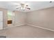Spacious bedroom features neutral carpet, ceiling fan, and ensuite bathroom, creating a relaxing retreat at 105 Birch Creek Cir, Mcdonough, GA 30253