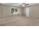 Bedroom features neutral walls, carpet, ceiling fan and a window at 105 Birch Creek Cir, Mcdonough, GA 30253