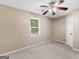 Bedroom with neutral walls, natural light, and ceiling fan at 105 Birch Creek Cir, Mcdonough, GA 30253