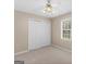 Neutral bedroom with soft carpet, spacious closet, and large window, offers a serene and relaxing space at 105 Birch Creek Cir, Mcdonough, GA 30253