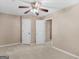 Bedroom with a ceiling fan, large closet and big windows, creating a restful atmosphere at 105 Birch Creek Cir, Mcdonough, GA 30253