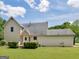 Rear exterior of home with lawn and wooden deck at 105 Birch Creek Cir, Mcdonough, GA 30253