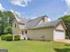 View of the rear exterior of the house and the back yard at 105 Birch Creek Cir, Mcdonough, GA 30253