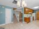 Cozy eat-in kitchen features classic wood cabinets and an open layout to the living area at 105 Birch Creek Cir, Mcdonough, GA 30253