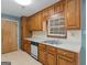Kitchen with wood cabinets, stainless steel sink, and lots of storage space at 105 Birch Creek Cir, Mcdonough, GA 30253